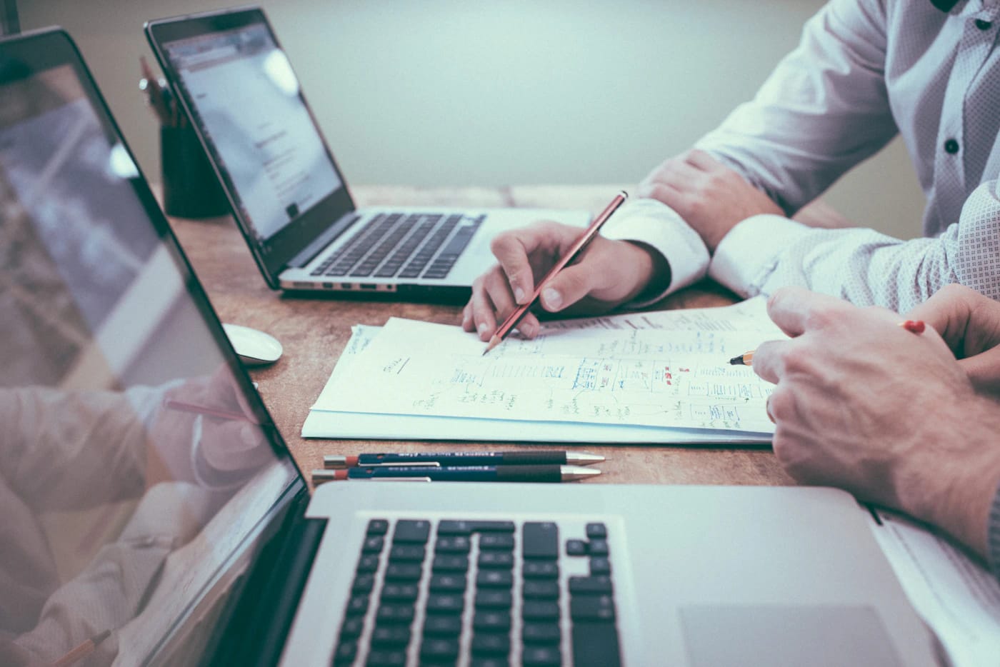 Planning a strategy with documents and a laptop
